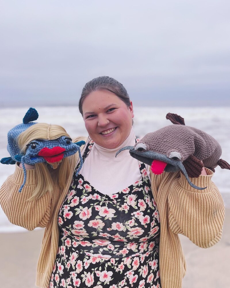 Blue at the beach with two handmade puppets